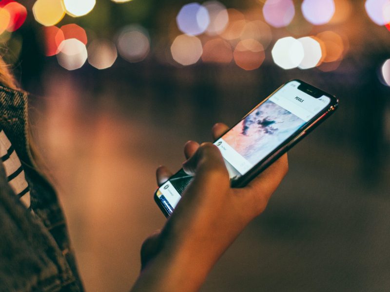 person holding space gray iphone x