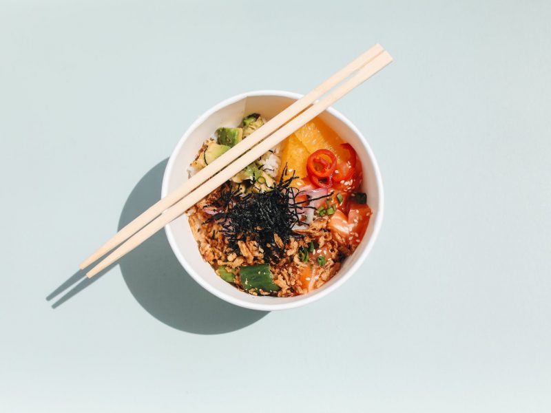 photo of wooden chopsticks on a poke bowl