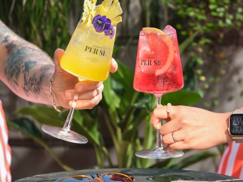 refreshing summer cocktails with sunglasses outdoors